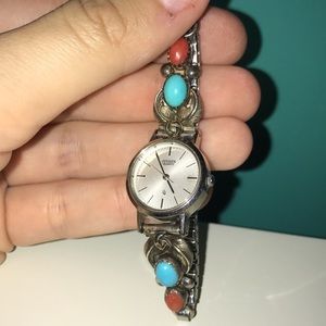 Wrist watch with turquoise stone and orange stone